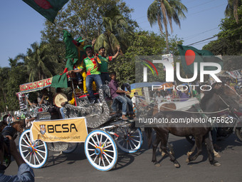 Bangladesh supporters celebrate riding Horse carriage on the streets of Dhaka after winning the 2015 ICC Cricket World Cup match against Eng...