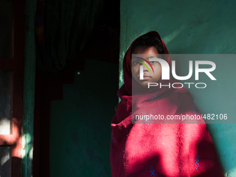 Portrait of a girl outside of her house in Khadim Tea Estate in Sylhet, Bangladesh. (