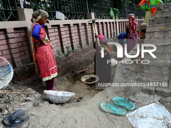 Bangladeshi women day laborer works in a road construction site in Dhaka, Bangladesh, on September 7, 2019. (