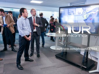 French Junior Minister for Digital affairs Cedric O (center, blue shirt) speaks with students and teachers as he visits, on September 9th, 2...