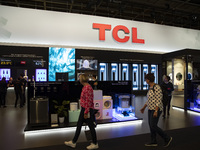 Visitors at TCL boot during the international electronics and innovation fair IFA in Berlin on September 10, 2019. (