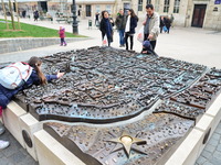 Tourists and citizens visit scale model 