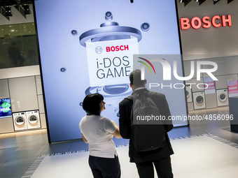 Visitors play with a virtual interactive game at Bosch boot during the international electronics and innovation fair IFA in Berlin on Septem...