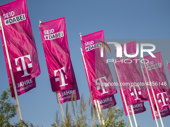 Flags of the Deutsche Telekom are pictured during the international electronics and innovation fair IFA in Berlin on September 11, 2019. (