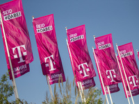Flags of the Deutsche Telekom are pictured during the international electronics and innovation fair IFA in Berlin on September 11, 2019. (