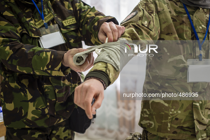 Volunteers and reserve soldiers are learning basics of first aid and swathing bandage at training center 'Patriot', Kyiv, Ukraine. 15 of Mar...