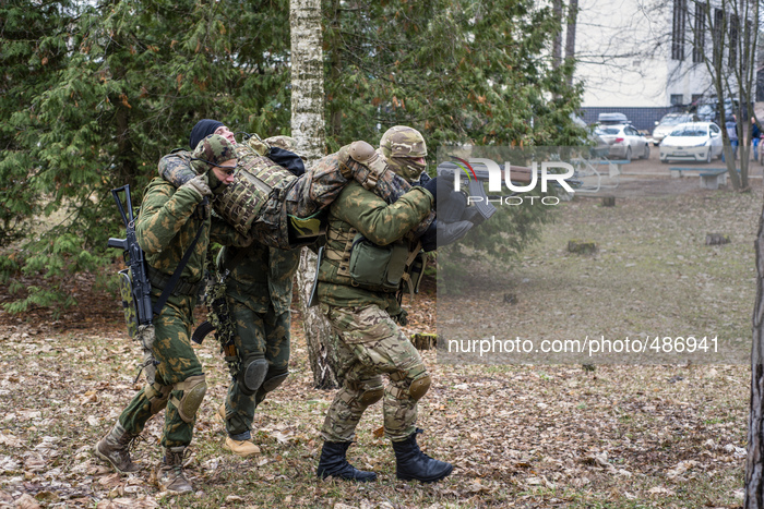 Volunteers and reserve soldiers are learning basics of first aid and injured transportation during combat at training center 'Patriot', Kyiv...