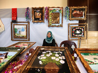  Palestinians participate in the opening of an exhibition of Palestinian heritage entitled 