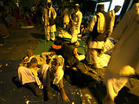 An Indian farmer take a rest on a road in a night they came for a protest against the land acquisition bill in New Delhi on March 18,2015.Th...