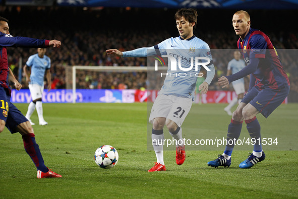 BARCELONA, SPAIN - MARCH 18: David Silva and Jeremy Mathieu  during the UEFA Champions League round of 16 match between FC Barcelona and Man...