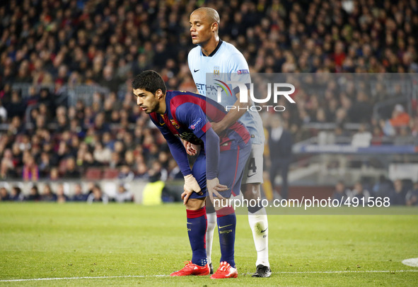 BARCELONA, SPAIN - MARCH 18: Vincent Company and Luis Suarez  during the UEFA Champions League round of 16 match between FC Barcelona and Ma...