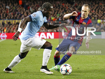 BARCELONA, SPAIN - MARCH 18: Bacary Sagna and Andres Iniesta during the UEFA Champions League round of 16 match between FC Barcelona and Man...
