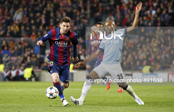 BARCELONA, SPAIN - MARCH 18: Leo Messi and Fernandinho during the UEFA Champions League round of 16 match between FC Barcelona and Mancheste...