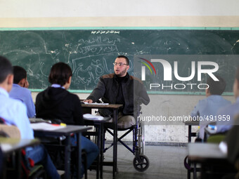  Disabled Palestinian teacher Ahmed al-Sawaferi, 25, who said that he lost his both legs and his left arm in an Israeli air strike in 2008,...