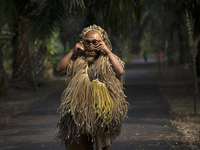 Indigenous Mah Meri dancer arrived in traditional costume with dance mask 'Bajus' for Hari Moyang (Ancestors Day) celebration at Sungai Bumb...