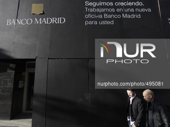 A man walks past a Banco de Madrid new office in Vigo, northwestern Spain on March 21, 2015 (