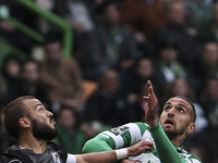 Guimaraes's midfielder Andre Andre (L) challenges Sporting's defender Miguel Lopes during the Portuguese League  football match between Spor...