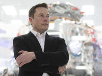 SpaceX Chief Engineer Elon Musk speaks in front of Crew Dragon cleanroom at SpaceX Headquarters in Hawthorne, California on October 10, 2019...