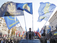 Ukrainians take part at a march to the 77th anniversary of the founding of the Ukrainian Insurgent Army in central Kiev, Ukraine, on 14 Octo...
