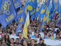 Ukrainians participate a march under the flags of far-right Svoboda party marking 77th anniversary of Ukrainian Insurgent Army (UPA) in down...
