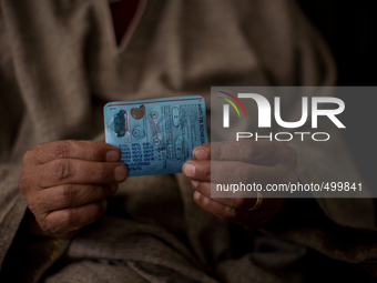 SRINAGAR, INDIAN ADMINISTERED KASHMIR KASHMIR, INDIA - MARCH 23: A Kashmiri man and  patient of Tuberculosis  shows his anti TB medicines wh...