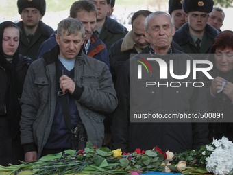 Relatives and friends attend the funeral ceremony of the Aidar battalion servicemen Vadim Shalatovsky (31) and Nazar Yakubovsky (17), who we...