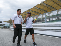 Spanish F1 driver, Fernando Alonso (R) of Mc Laren Honda  and  Honda R&D Senior Managing Officer, Yasuhisa Arai, chats
ahead of Malaysian Fo...