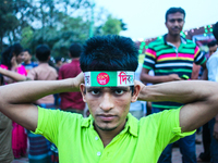 A Bangladeshi boy is wearing a hair bandana with Bangladeshi flag on the occasion of independence day at Dhaka, Bangladesh, March 26, 2015....