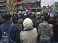 People observing the Sevice of Reinternment for King Richard III of England and Wales, relayed over a television, in Leicester city centre o...