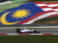 Brazilian Felipe Nasr of Sauber Martini Racing drive pass Malaysian flag during first practice session of Malaysian Formula One Grand Prix a...