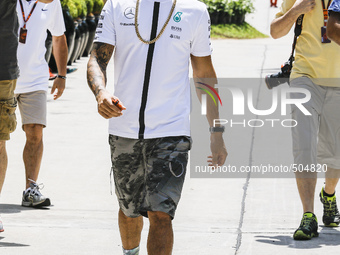 British F1 driver Lewis Hamilton of  Mercedes AMG Petronas F1 Team walks at paddock area during the Malaysian Formula One Grand Prix at Sepa...