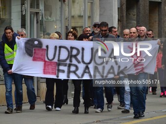 Croatian citizens protest against Swiss Franc loans in front of Croatian National Bank organized by Association Swiss Franc. They lighted 10...