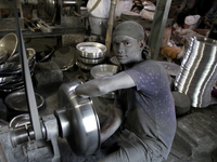 Bangladeshi Workers working in an aluminum pot-making small factory in Dhaka, Bangladesh, October 28, 2019. Aluminum Factory is very common...