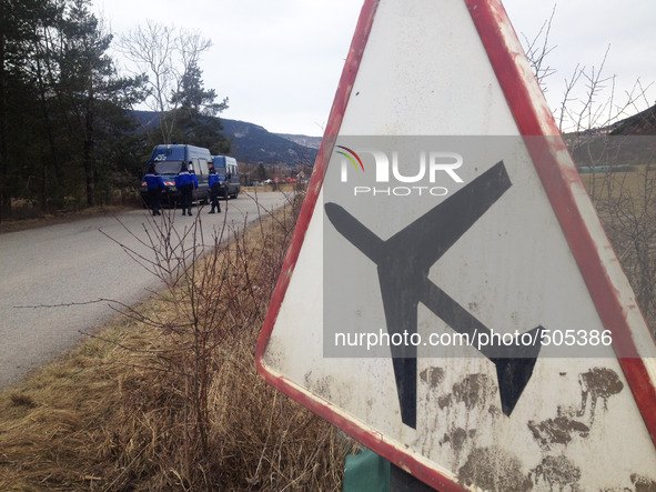 (150325)-- SEYNE-LES-ALPES, March 25, 2015() -- French gendarmes guard the road to the crash site of Germanwings A320 plane in the Alps in s...