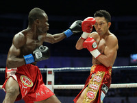Quezon City, Philippines - Ryo Akaho of Japan (R) evades a punch against Prosper Ankrah of Ghana (R) during their WBO World Jr. Flyweight Ch...