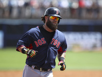 Boston Red Sox first baseman Mike Napoli (12) rounds the bases after hitting a home run against the Tampa Bay Rays during the third inning o...