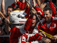 German Sebastian Vettel of Scuderia Ferrari celebrate with his team after won the  Malaysian Formula One Grand Prix at Sepang International...