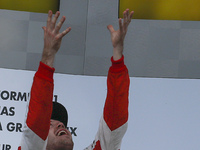 German Sebastian Vettel of Scuderia Ferrari celebrates on a podium after won the Malaysian Formula One Grand Prix at Sepang International Ci...