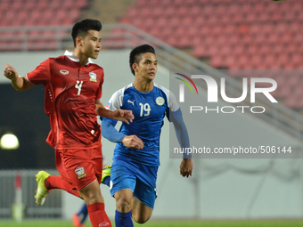Paolo Salenga of Philippines (R) fights for the ball with Suwannapat Kingkaew of Thailand during the AFC U-23 Championship 2016 qualifiers r...