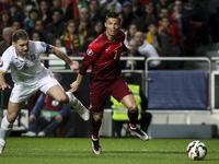 Portugal´s forward Cristiano Ronaldo (R) challenges Serbian´s defender Branislav Ivanovic during the Portugal vs Serbia EURO 2016 qualifying...
