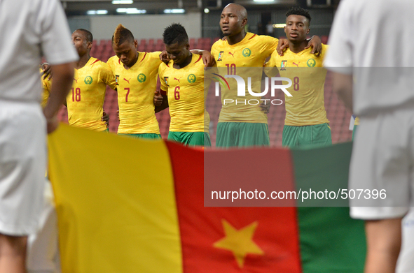 (L-R) Eyong Enoh, Clinton N'Jie, Ambroise Oyongo, Jacques Zoua and Benjamin Moukadjo of Cameroon line-up ahed of the international friendly...