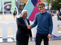Portugal's Prime Minister Antonio Costa (L) shakes hands with Web Summit's Irish chief executive officer Paddy Cosgrave during the annual We...