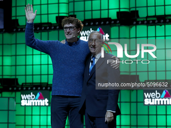 Portugal's President Marcelo Rebelo de Sousa (R ) hugs Web Summit's Irish chief executive officer Paddy Cosgrave  during the closing ceremon...