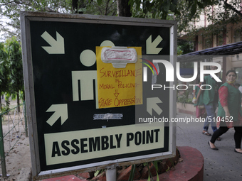 JU students passing by a sign with message written on sanitary napkin during a Sanitary napkin protest  in Kolkata, India. (