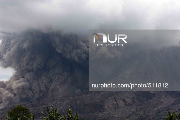 Sinabung spewed volcanic material with heat clouds headed south as seen from the village of Three Kicat in Karo, North Sumatra, Indonesia, A...