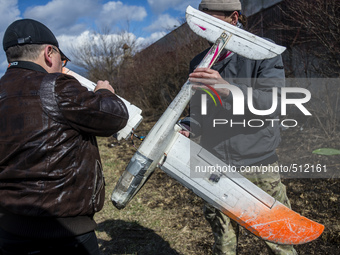 Trainer and his student repair drone used for training Ukrainian soldiers to control unmanned aerial vehicle in the field at Training Center...