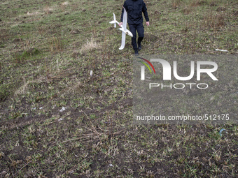 Ukrainian soldier of Azov Battalion of Ukrainian Special Forces holds crashed drone used for training controlling unmanned aerial vehicle in...