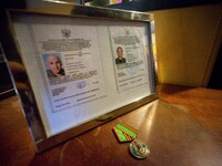 The press passes of Graham Phillips and his fellow journalist for reporting in eastern Ukraine shown in the event before being autioned. - P...