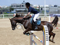 Palestinian men ride horses during Training course in Gaza City (