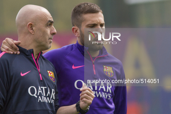 Barcelona, Spain. 2015 April 4. The defender Jordi Alba with one of the doctors coaches of FC Barcelona, during the training session of Apri...